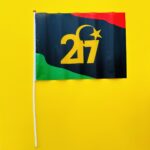 علم استقلال ليبيا مع كتابة 17/2وهلال