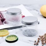 علب بلاستيك شفافة لحفظ المنتجات والكريمات غطاء فضي حجم 100 & 200 مل