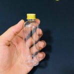 ⁦دستة علب شفافة بلاستيك عبوة 100 مل عدد 12 شيشة مغطة ذهبية⁩ - الصورة ⁦5⁩