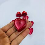 ⁦مجموعة شموع حمراء على شكل قلب 12 شمعة⁩ - الصورة ⁦2⁩