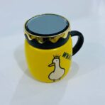 ⁦مق سيراميك مع غطاء هدية رسمة بطوط⁩ - الصورة ⁦2⁩