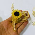 ⁦مساكة شعر ترند راقية وردة عباد الشمس لون عسلي / برتقالي & أسود⁩ - الصورة ⁦3⁩